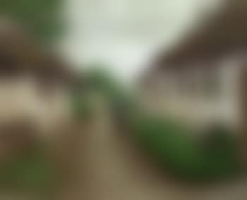 Woman and man smoking pipe in front of thatched house (preview)