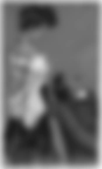 Man in lounge chair watching woman removing blouse (preview)