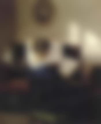 Interior scene with woman seen from behind reading at the spinet (preview)