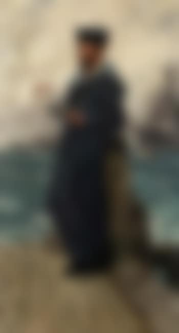 Sailor from HMS Invincible reading on a quayside (preview)