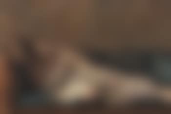 Reclining fishermen on green sofa (preview)