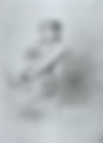 Pensive girl seated at a table (preview)
