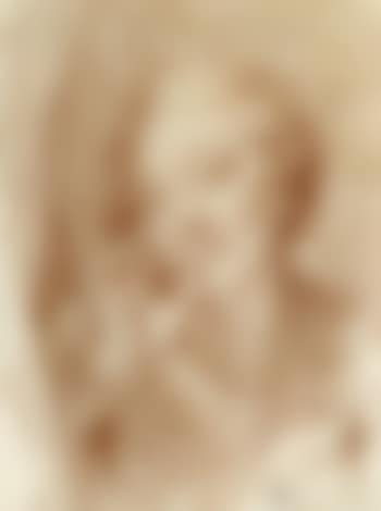 Young woman appearing behind curtain, her hand at her mouth (preview)