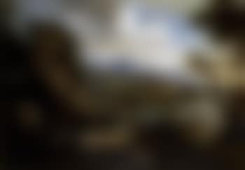Coastal landscape with figures by a rocky inlet, fortified town beyond (preview)
