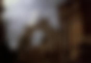 Landscape with classical figures examining a stone relief amid Roman ruins (preview)