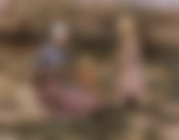 Young mother and two daughters making garland in dunes (preview)