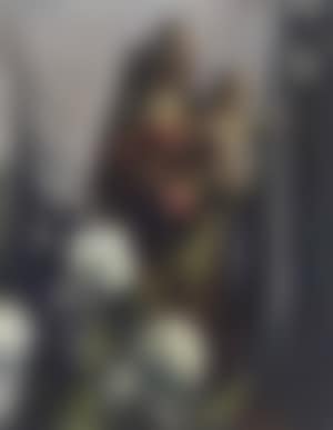 A statue of the Madonna with flowers (preview)