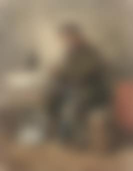 A seated man smoking a pipe (preview)