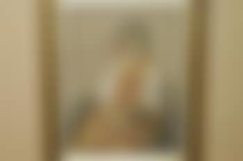 Portrait of a young girl, seated, three quarter length, wearing orange and yellow robes (preview)