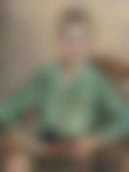A young boy seated in a chair (preview)