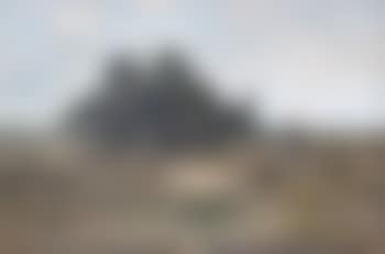 Landscape with man standing by a tree (preview)