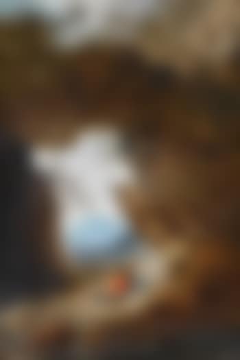 A young man and his dog resting on rocks beside a river (preview)