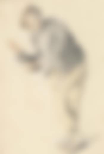 A young man leaning on a chair, in the midst of telling a story (preview)