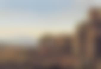 An Italianate landscape with with figures conversing amongst ancient ruins, a fortified city and mountains beyond (preview)