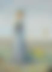 Young blond girl in a long blue summer dress on the beach (preview)