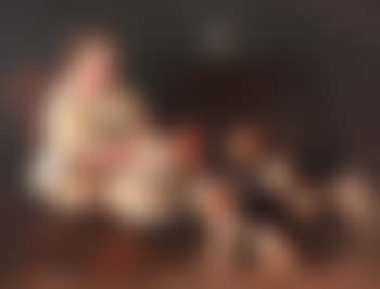 A young child feeding two young hounds (preview)
