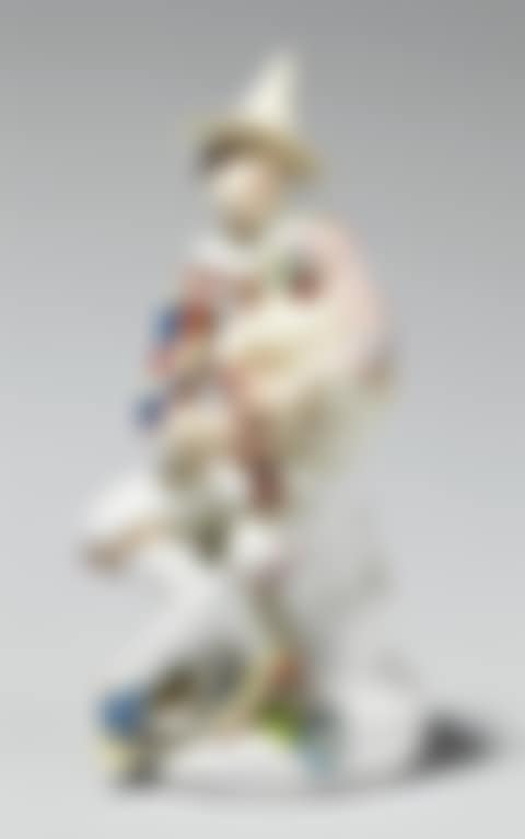 A figure of harlequin playing bagpipes (preview)