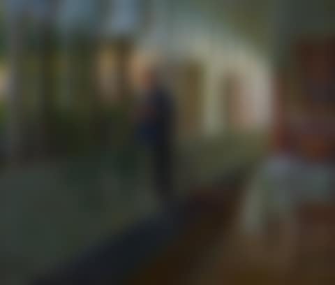 Young priest sitting on a wall in the cloister of the albergo della Luna in Amalfi, in the background the Madonna della Civita de Zahrtmann (preview)