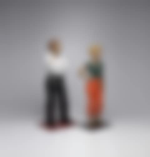 Man in White Shirt; and Woman in Orange Pants with Hand on Hip (preview)