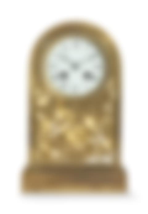 A 'GRAPE VINE' PATTERN MANTEL CLOCK (preview)