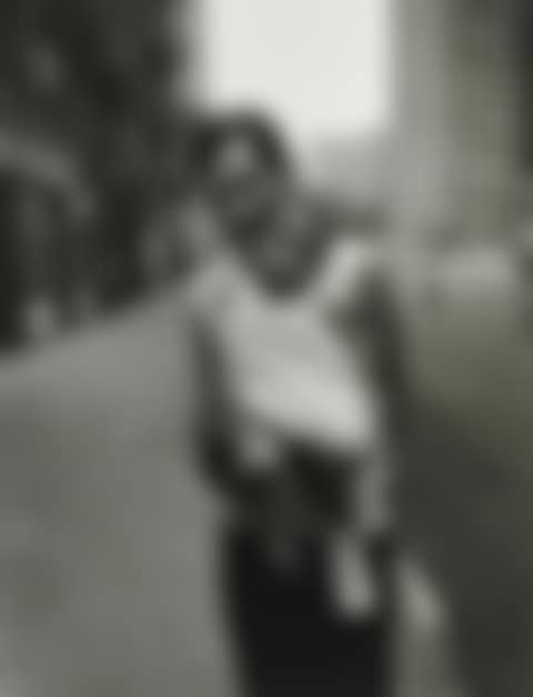 Untitled (Young man holding baby),  from "East 100th Street" (preview)