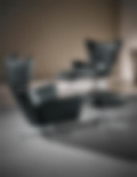 Pair of 'Ox' armchairs and ottomans (preview)