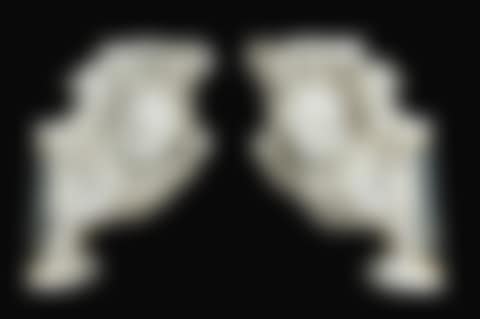 Pair of scrolls decorated with angel's heads (preview)