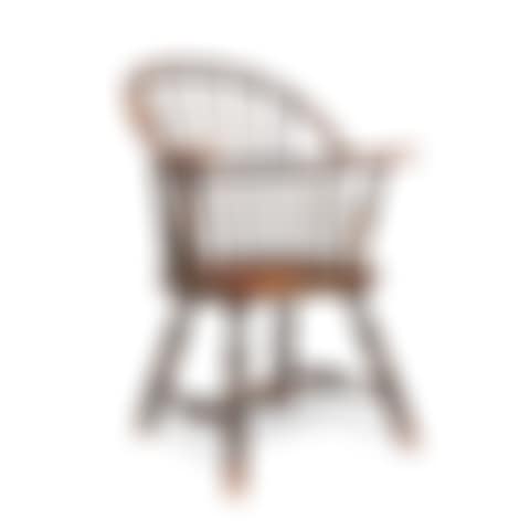 A BLACK-PAINTED MAPLE AND ASH SACK-BACK WINDSOR ARMCHAIR (preview)