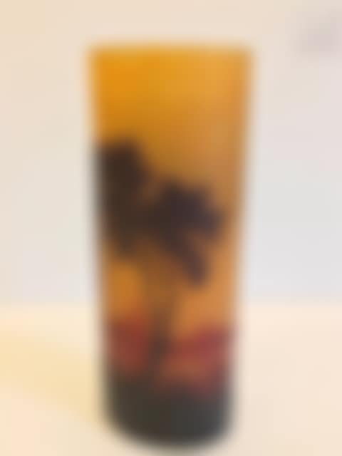 Multilayer glass vase decorated with a brown lake landscape with red nuances on an opaque yellow background (preview)