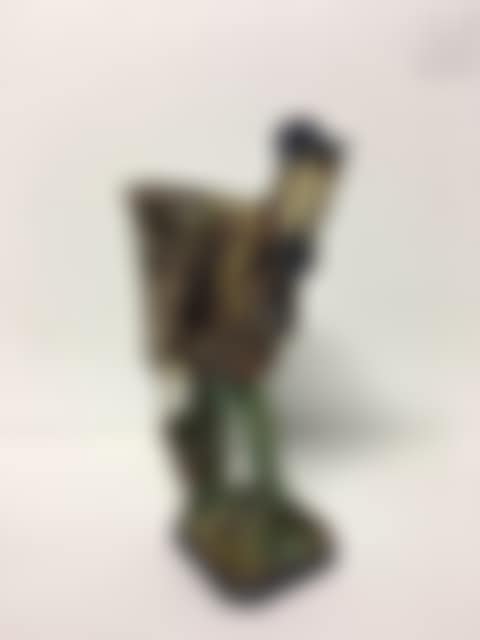 Polychrome enameled ceramic subject depicting a young man with a basket (preview)