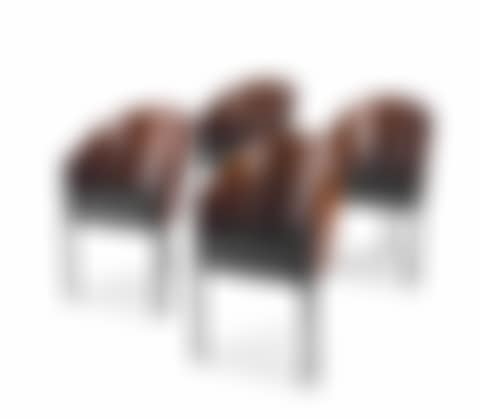 A set of four Café Costes rosewood-veneered and leather chairs (preview)