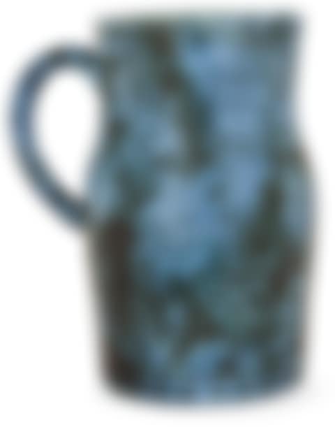 A blue enamelled eartheware pitcher with incised animals and plant decoration; Blue enamelled earthenware pitcher (preview)