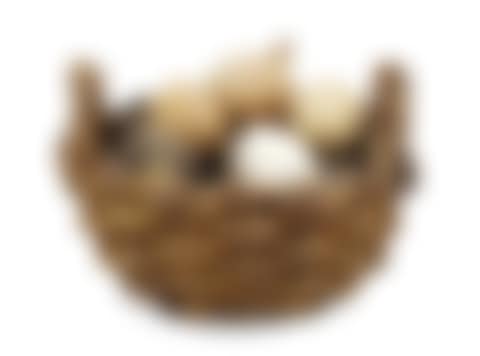 An Ingrid Herrlin stoneware basket with potatoes, onion and eggs (preview)