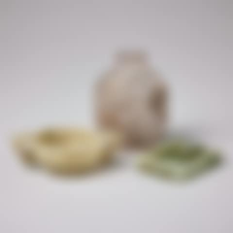 A ROCK CRYSTAL SNUFF BOTTLE, A NEPHRITE CUP WITH RAISED BOSSES AND A BELT BUCKLE (preview)