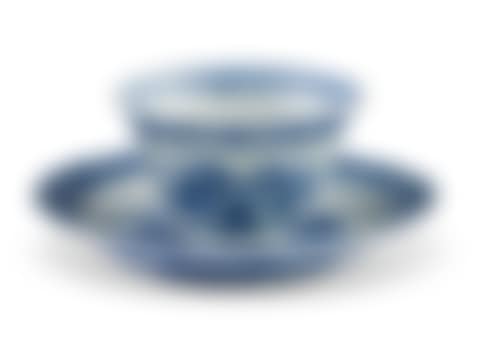 A CHINESE EXPORT PORCELAIN BLUE AND WHITE LOTUS-MOLDED 'ACUPUNCTURE' TEABOWL AND SAUCER (preview)