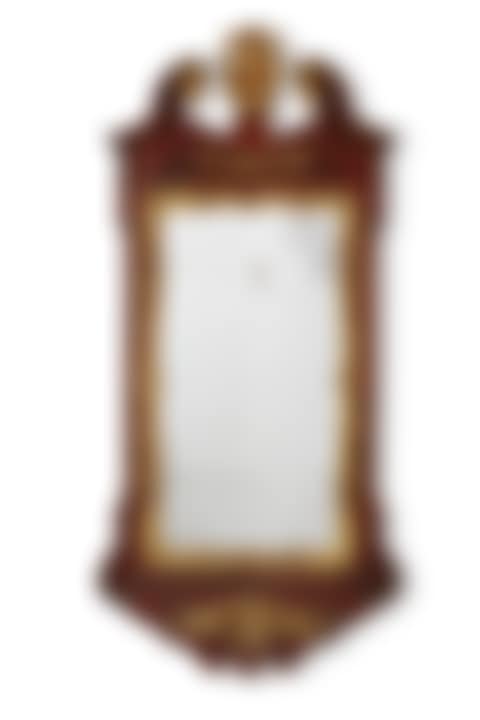 A GEORGE II CARVED MAHOGANY AND PARCEL GILT MIRROR (preview)