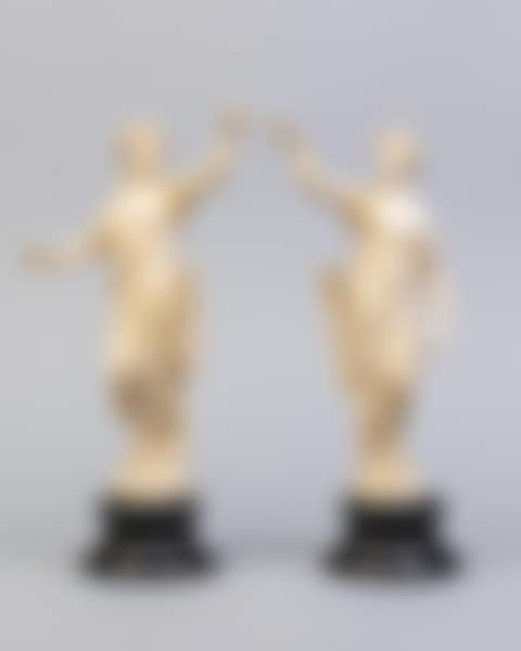 A pair of early 19th century French ivory figures of Greek huntresses on black socle bases (preview)
