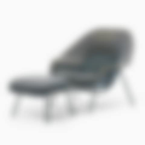 Armchair with footstool. "Womb chair"; An Eero Saarinen "Womb chair" with foot stool (preview)