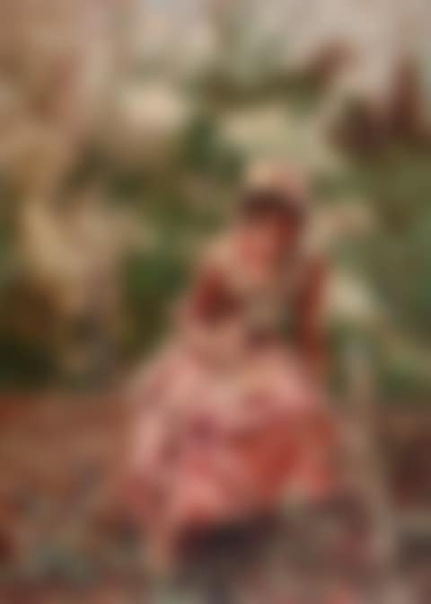 Portrait of a girl seated on a wall, wearing pink (preview)