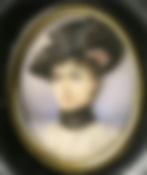 A lady, head and shoulders wearing a black hat (preview)