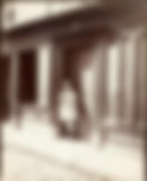 Prostitute in front of the door of a brothel “au grand 2” (preview)