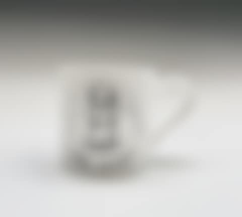 A Royal Doulton bone china mug showing a design of a dog (preview)