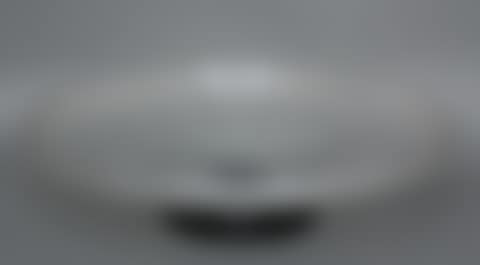 Frosted white transparent glass bowl on a black opaque glass foot (preview)