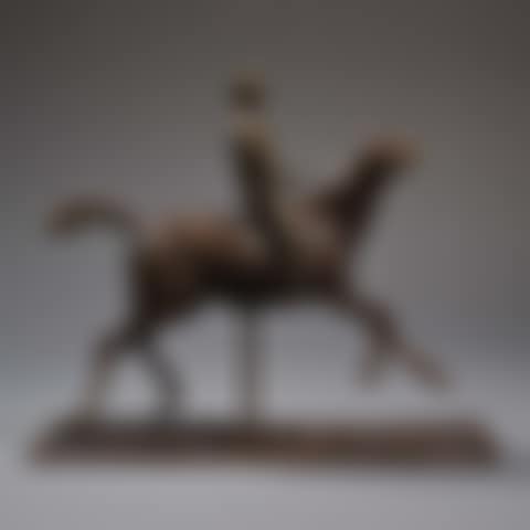 Galloping horse turning head to the right with its jockey (preview)