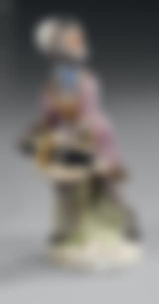 Polychrome figurine representing a monkey musician standing on a mound playing the old violin From the orchestra of monkey musicians (preview)