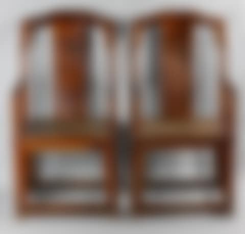 PAIR OF CHINESE HUANGHUALI CONTINUOUS YOKEBACK ARM CHAIRS (preview)
