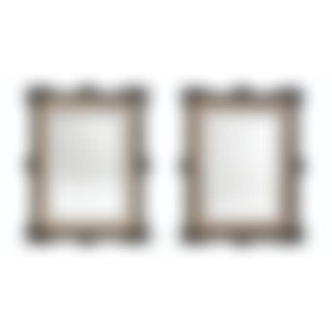 A PAIR OF FRENCH GILT-METAL-MOUNTED EBONISED WALL MIRRORS (preview)