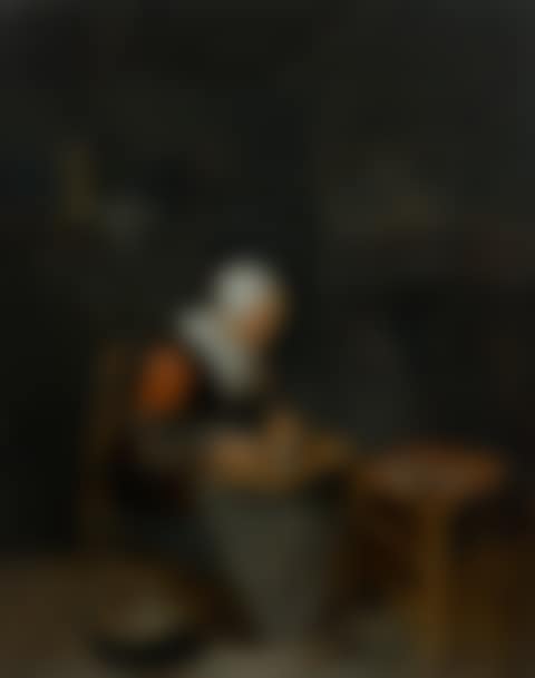 An elderly woman scaling fish in an interior (preview)