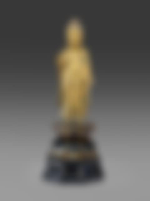 A GILT-BRONZE SCULPTURE OF A STANDING BUDDHA (preview)