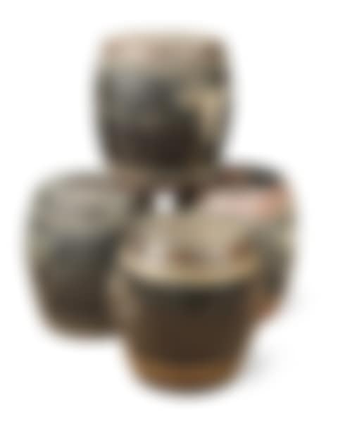 A group of four Chinese black lacquered and staved wood lidded rice barrels (preview)